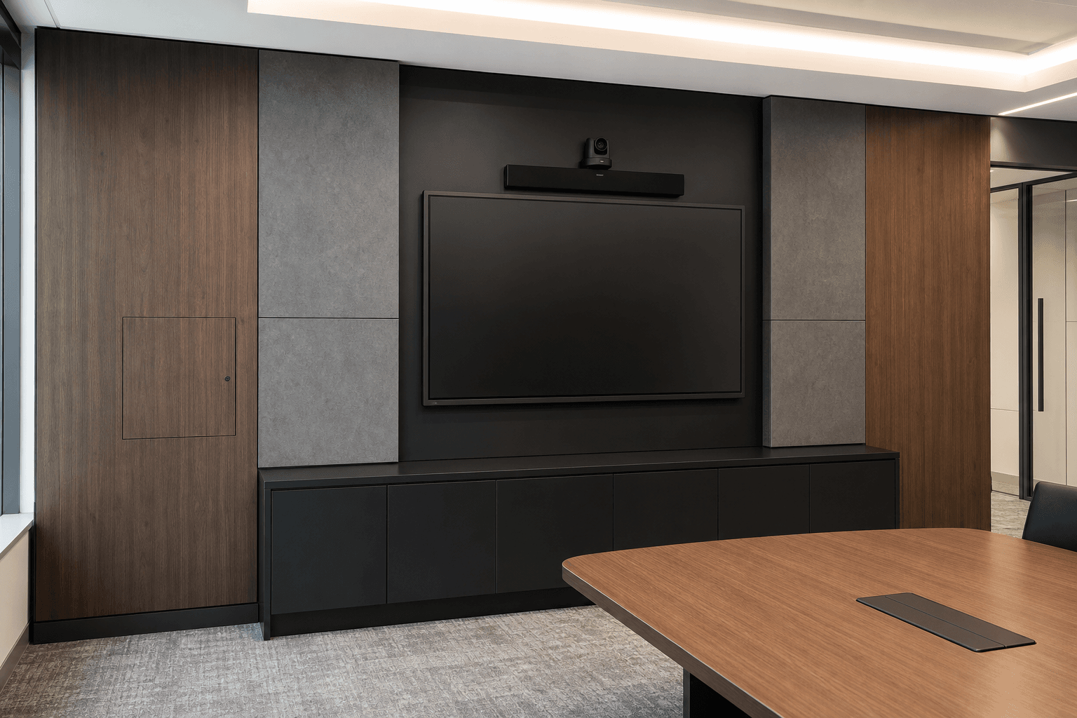 Bamboo charcoal panels installed around a corporate boardroom AV wall