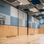 Acoustic Panels for Sports Halls: A B2B Guide to Impact Zones, Mounting Height, Building Services, and Maintenance